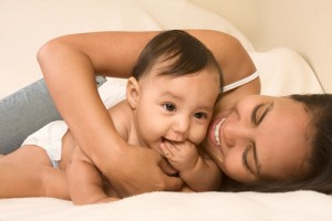 bigstock_Mother_Playing_With_Her_Baby_B_3190944