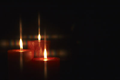 bigstock-Closeup-of-burning-candles-iso-27304853