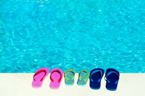flip flops at swimming pool from the family