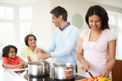 Indian Family Cooking Meal At Home