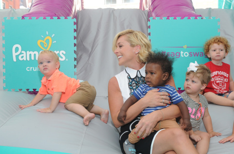 Actress and mom Jane Krakowski plays with babies at the launch of the Pampers Cruisers #SagToSwag Tour in New York, Wednesday, Aug. 12, 2015.   In celebration of the new and improved Pampers Cruisers diapers, Pampers is going on a national tour to transform the nationÕs babies from Òsag to swagÓ one bottom at a time.  (Photo by Diane Bondareff/Invision for Pampers/AP Images)