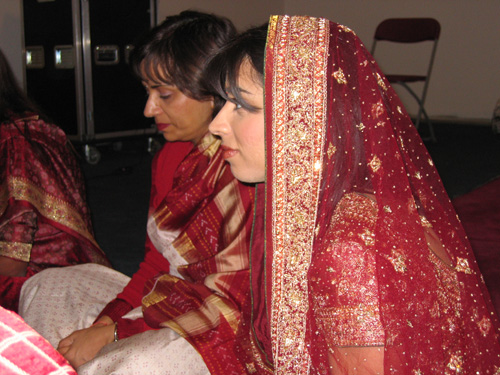 mom and daughter sitting in saris