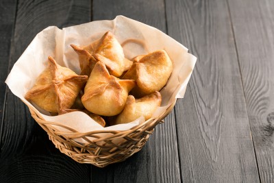 Baked samosa prepared from dough with filling (vegetables or meat)