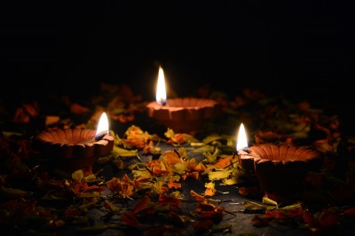 Indian Hindu Light Festival called Diwali Clay diya lamps lit during Diwali Celebration. Greetings Card Design