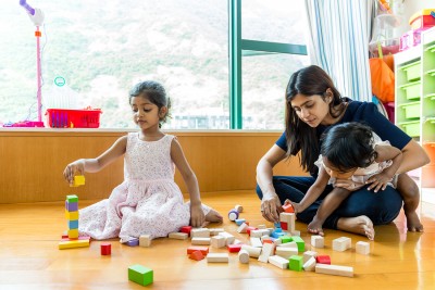 Indian family play toy block together at home