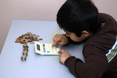 bigstock_Kid_Counting_His_Coins_small