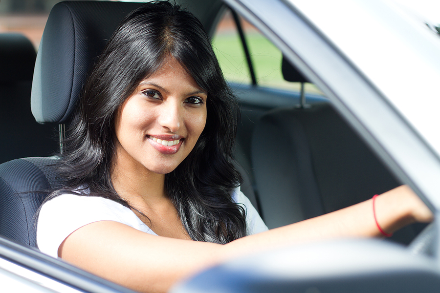 bigstock_young_indian_woman_driving_a_c_21900464