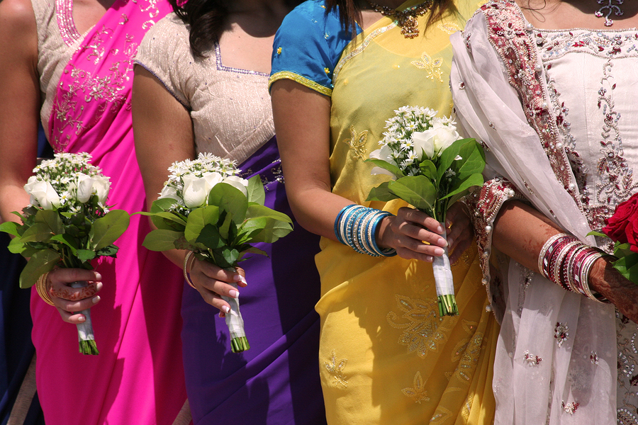 Bridal Party. Girls in colourful Saris at at Indian wedding